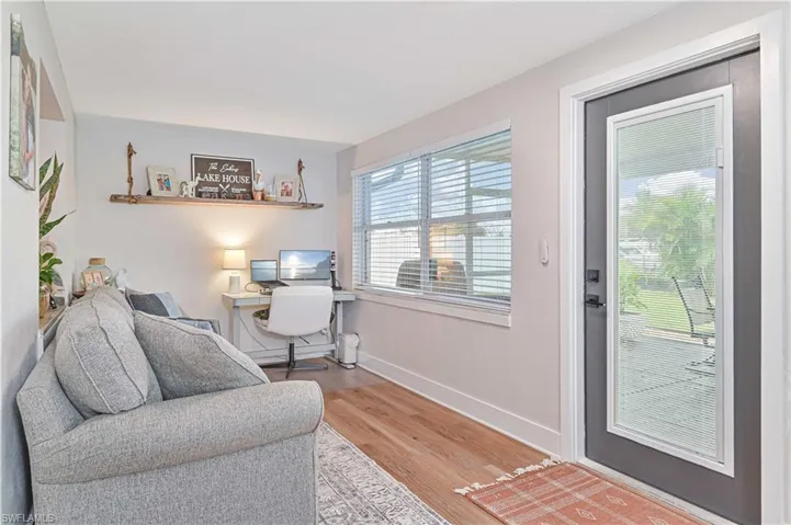 Living room with hardwood / wood-style floors