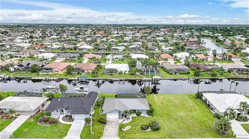Aerial perspective of suburban area with a large body of water