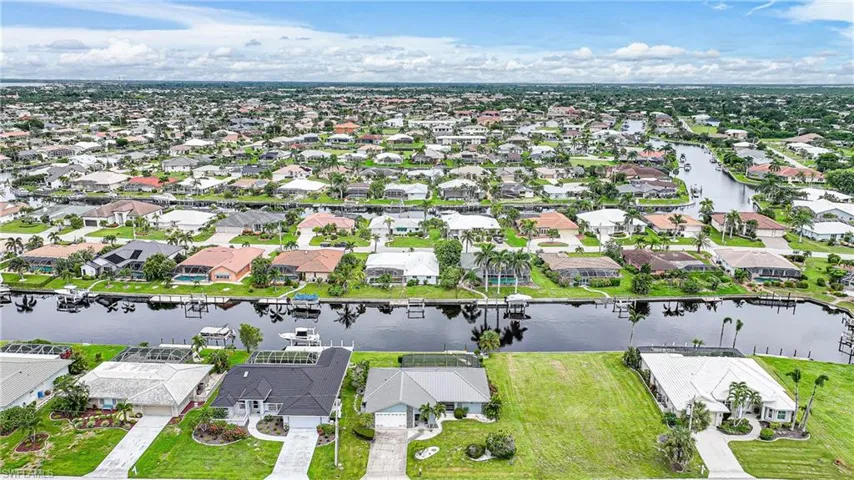 Aerial view of residential area with a nearby body of water