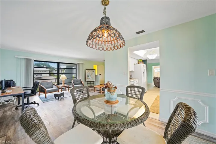Dining area with light wood-style flooring