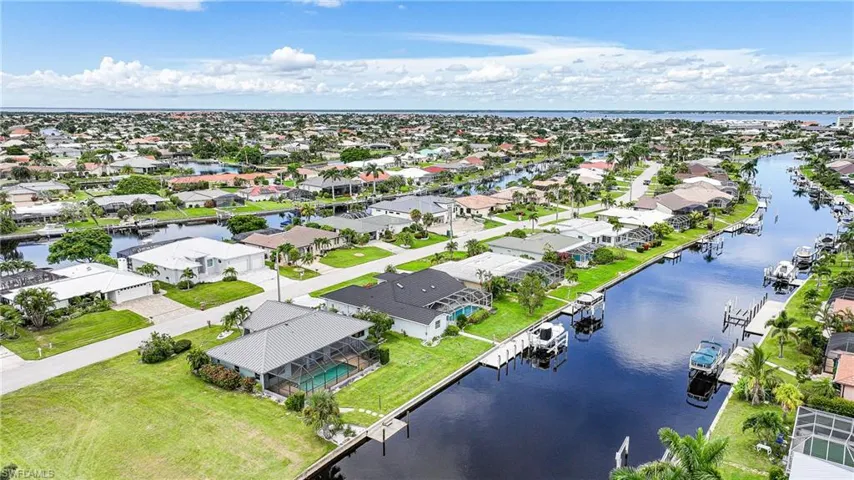 Aerial view of residential area with a large body of water