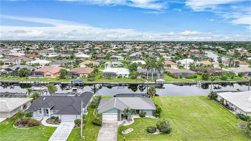 Aerial view of residential area with a nearby body of water