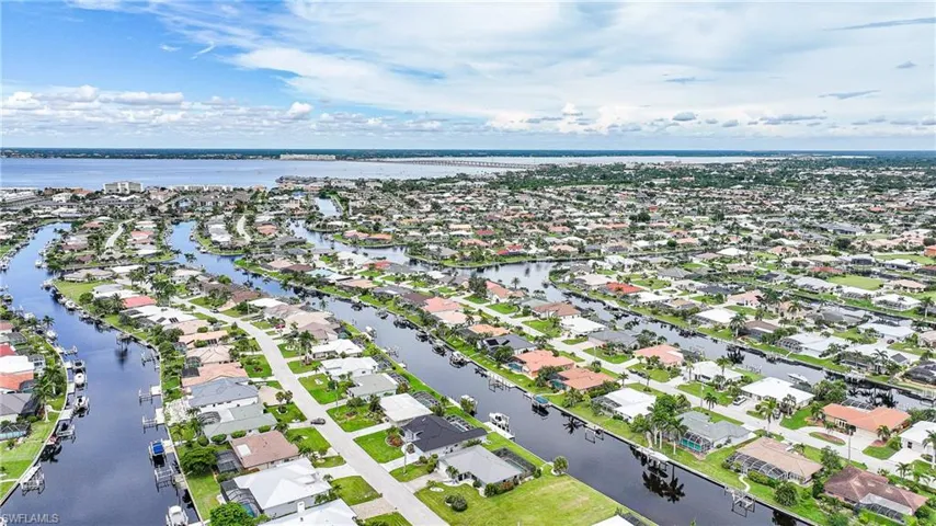 Aerial view of residential area with a large body of water
