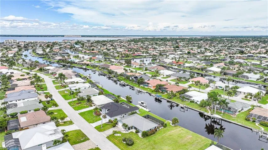 Aerial view of residential area with a large body of water
