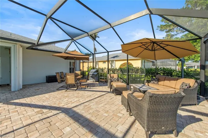 View of patio / terrace with glass enclosure and an outdoor living space