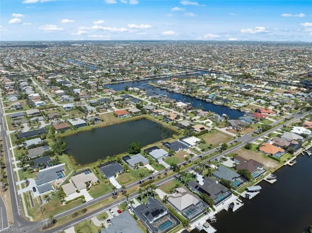 Aerial view with a water view and a residential view