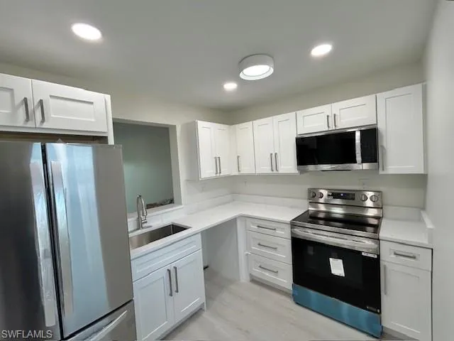 New cabinets, flooring,lighting, sink, faucet, and appliances.