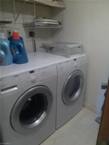 Washroom featuring electric dryer hookup and washer and dryer