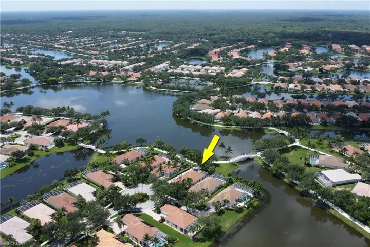 Aerial view of property and surrounding area with nearby suburban area