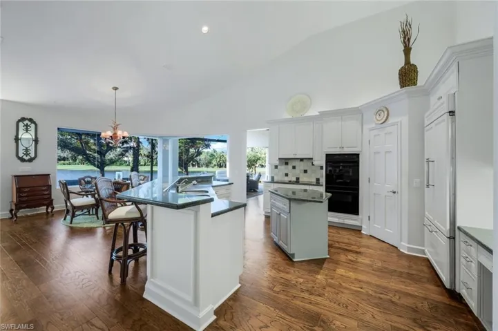 Plenty of white cabinetry, large pantry and views of the lake and golf course!