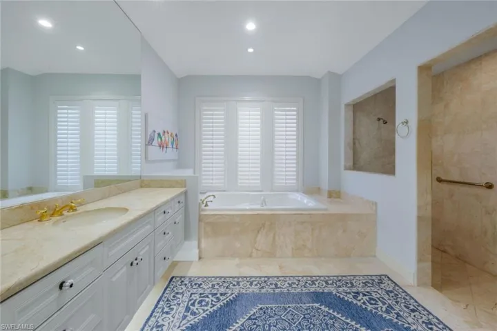 Tons of cabinet space, a soaking tub and a large walk-in shower.