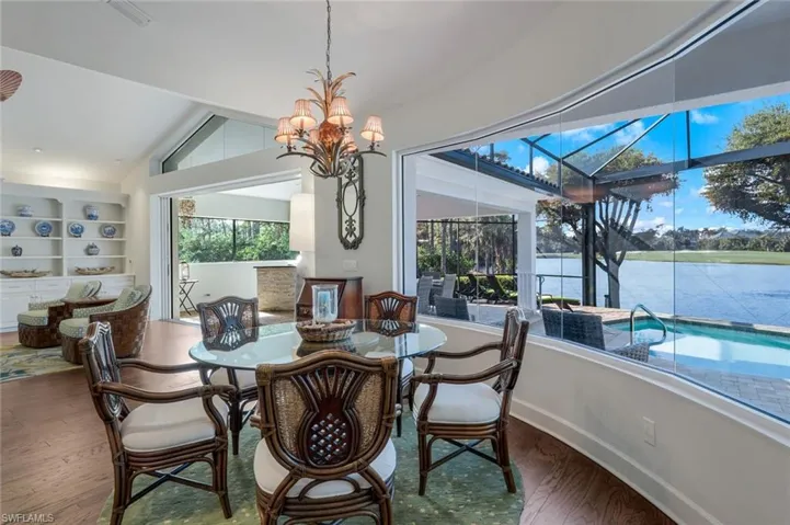 The great room offers vaulted ceilings, gorgeous wood flooring, tons of windows and plenty of room for family and friends.