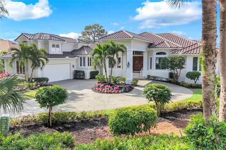 The porte-cochère contributes to the grand feeling of this stately home.