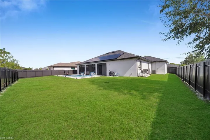 View of yard featuring a fenced in pool