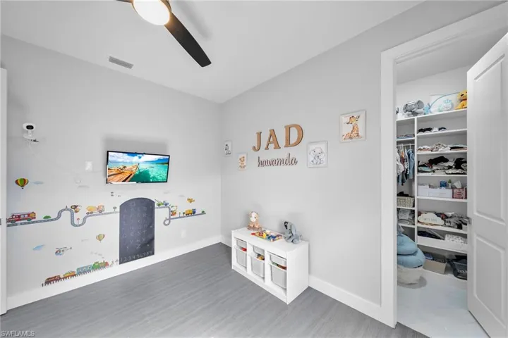 Rec room with hardwood / wood-style flooring and ceiling fan