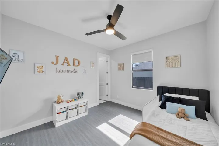 Bedroom featuring ceiling fan and wood-type flooring