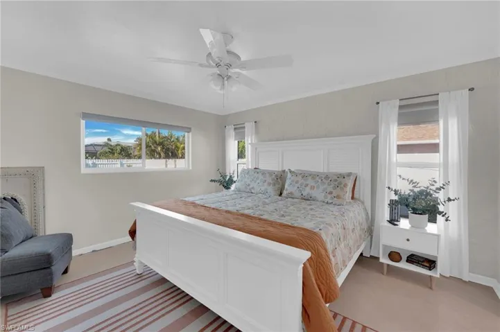 Bedroom with baseboards and ceiling fan
