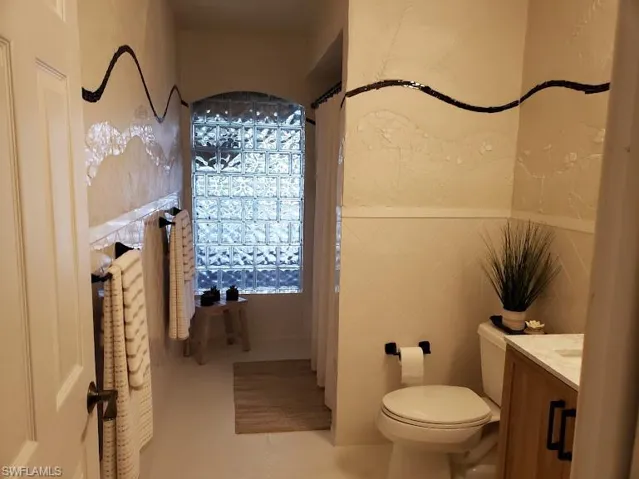 Bathroom with vanity and toilet