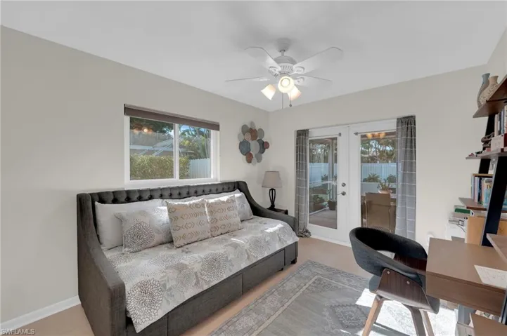 Bedroom featuring french doors, access to outside, and a ceiling fan