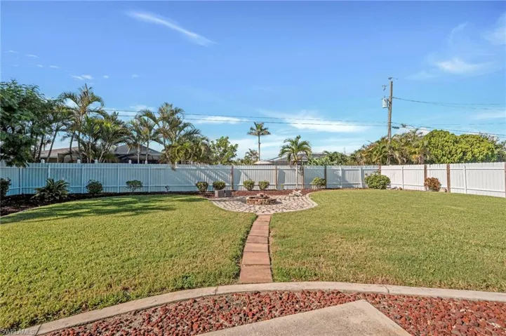 View of fenced backyard