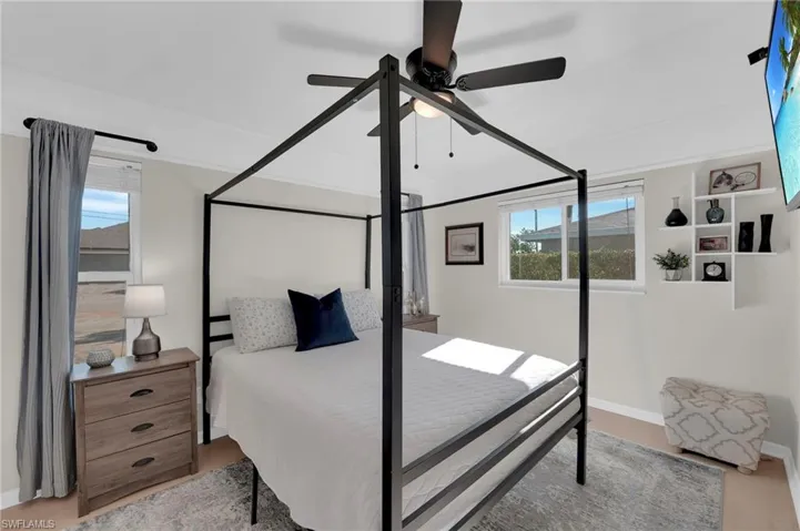 Bedroom with baseboards and ceiling fan