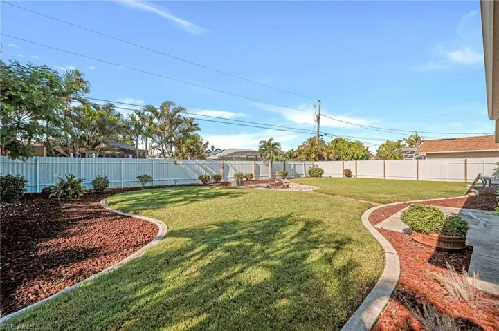 View of fenced backyard