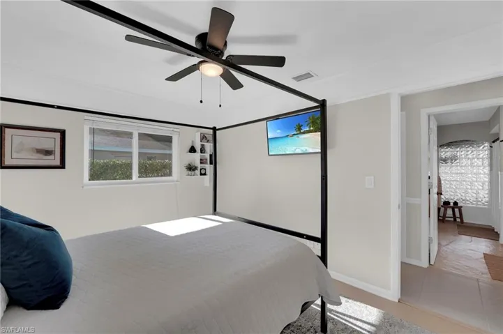 Bedroom featuring baseboards and a ceiling fan