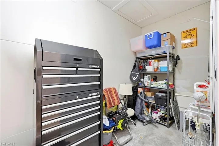 Storage room featuring attic access