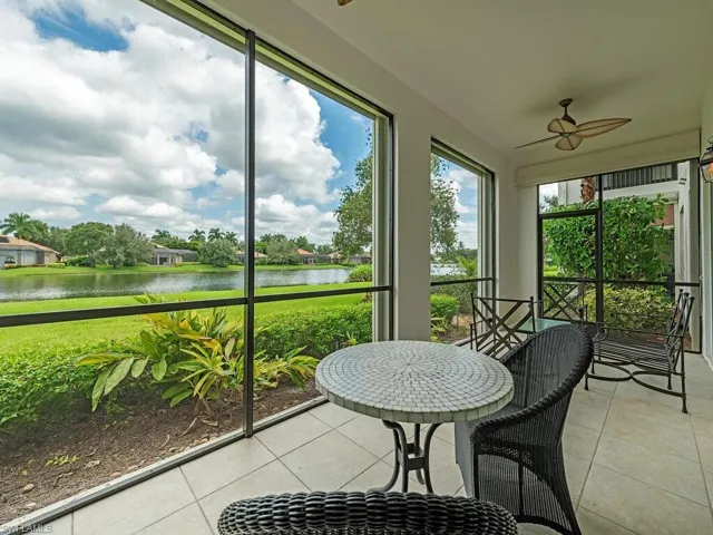 Sunroom with a water view