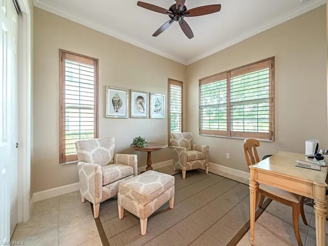 Office area with ceiling fan, plenty of natural light, and crown molding