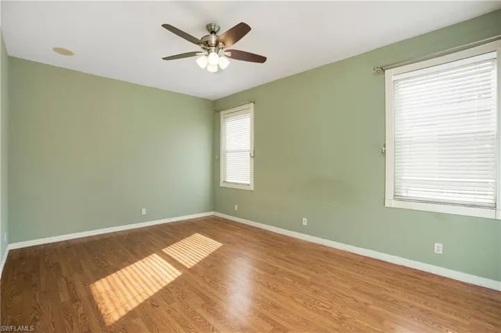 Spare room featuring wood finished floors and ceiling fan