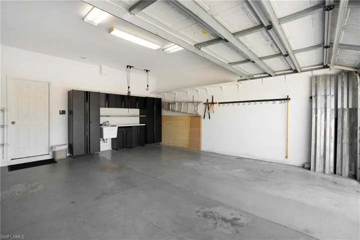 Garage featuring a sink