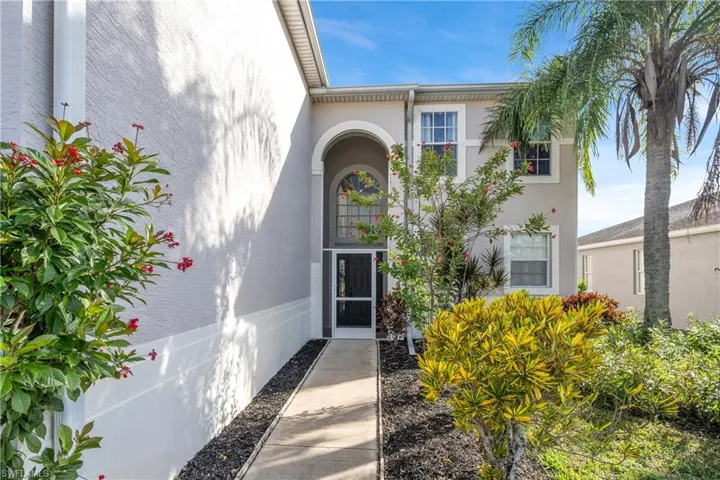 Property entrance featuring stucco siding