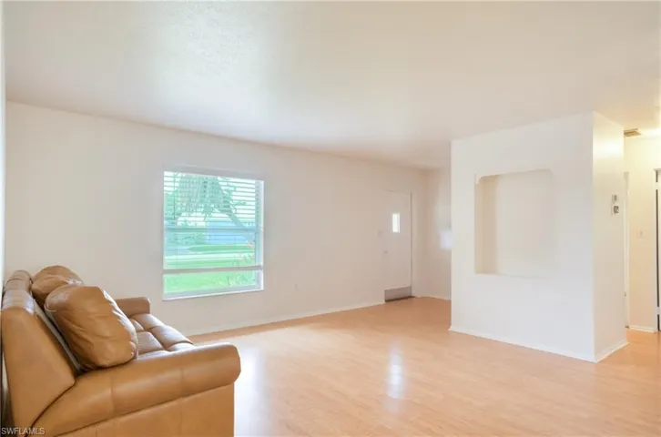 Foyer/Living room featuring light wood-style floors