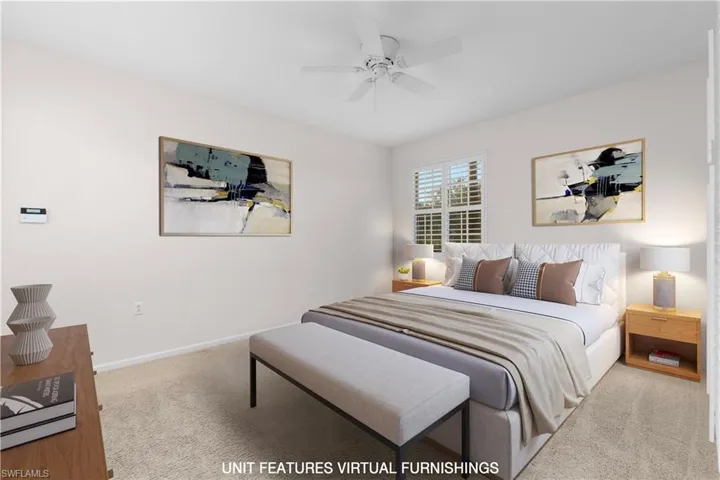 Carpeted bedroom with ceiling fan