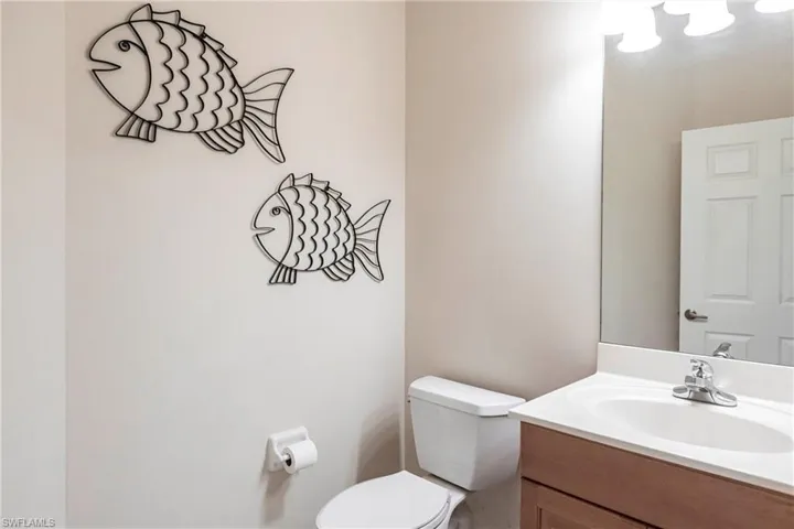 Half bath with vanity and toilet