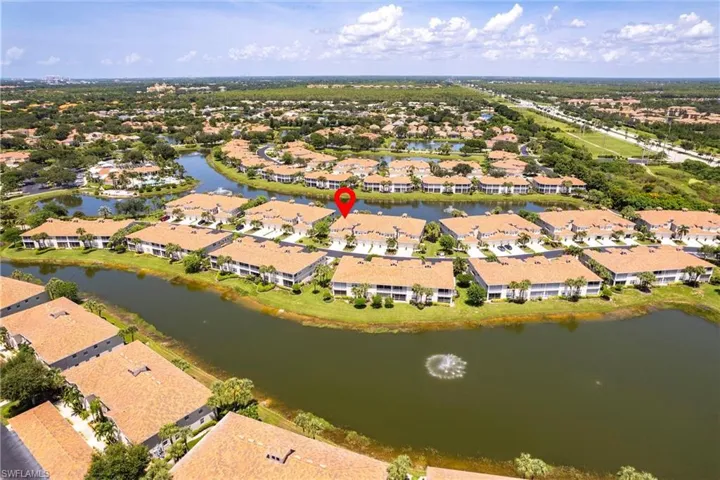 View of property location with a large body of water and nearby suburban area