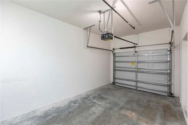 Garage featuring a garage door opener