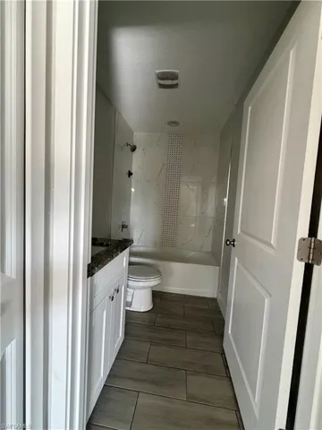 Full bathroom featuring vanity and shower / tub combination