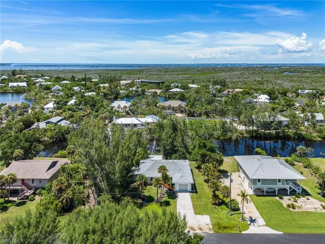 Aerial perspective of suburban area with a large body of water