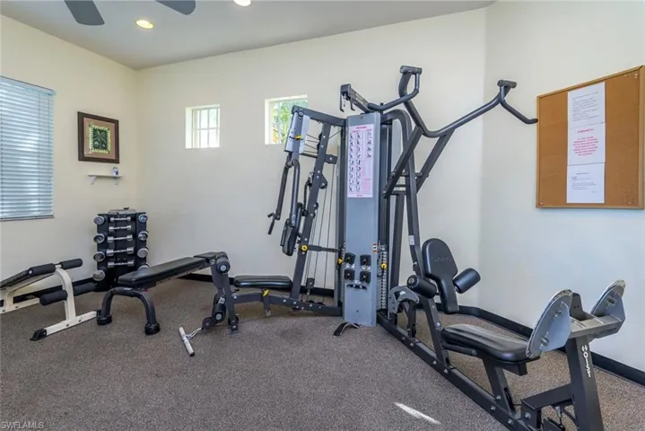 Workout area with recessed lighting and ceiling fan