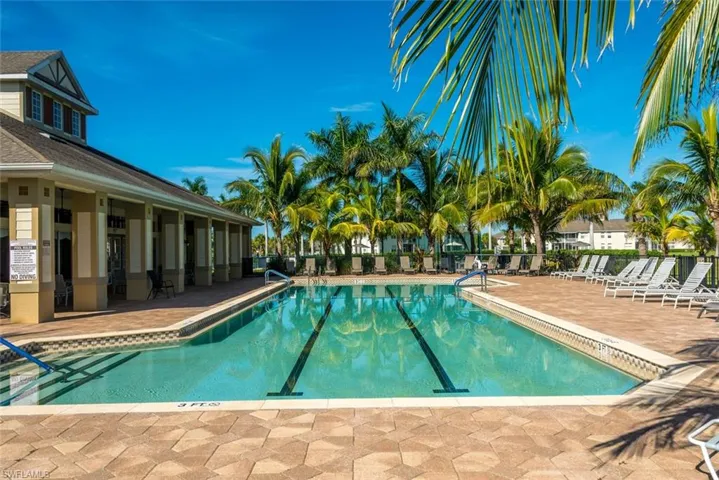 Community pool with a patio