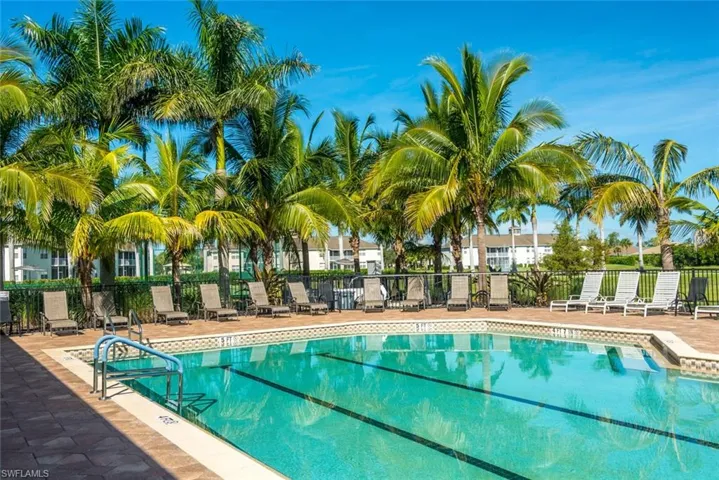 Community pool featuring a patio