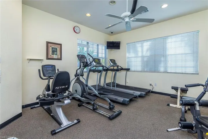 Workout area with recessed lighting and ceiling fan