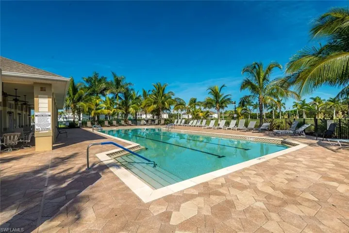 Community pool featuring a patio