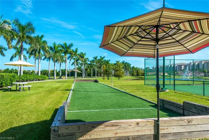 View of property's community with a bocce ball area