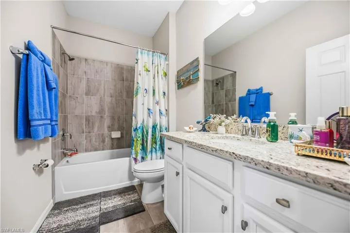 Full bathroom with vanity and shower / tub combo