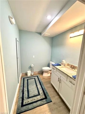 Bathroom featuring vanity, toilet