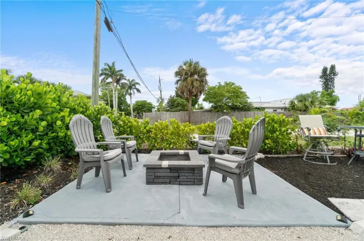View of patio with an outdoor fire pit