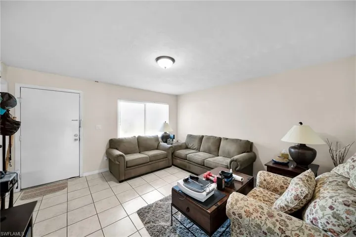 Living room featuring light tile patterned floors